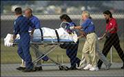 Actor Jason Priestley is removed from the infield hospital to an
awaiting helicopter after crashing his Infinity Pro Series car
during a practice session for the Kentucky 100. The accident
occurred Sunday at the Kentucky Speedway in Sparta, Ky.
