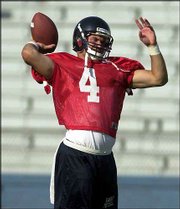 Kansas quarterback Bill Whittemore participates in a recent
practice. Whittemore shared the top spot with Dyer after spring
ball.