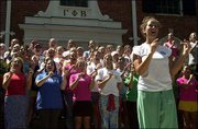 Overland Park junior Maggie Hodson, right foreground, leads her
sorority in song practice outside the Gamma Phi Beta house, 1339
West Campus Road. Hodson is the song chair for her house, which
will be recruiting freshman students next week. The sorority
recruitment is just one of a number of events taking place as
Kansas University prepares for Thursday's start of the 2002-2003
academic year.