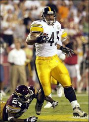 Pittsburgh running back Chris Fuamatu-Ma'afala (45) eludes
Washington Redskins cornerback Champ Bailey. Fuamatu-Ma'afala had a
36-yard gain on the play Sunday in Landover, Md.
