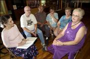 Relatives of Abner and Susan Griswold, who were Lawrence residents
at the time of Quantrill's raid, visit with Judy Sweets, left,
collections manager at Watkins Community Museum. From left are
Sweets; Bernard Rogers, Fenton, Mich.; his brother, Charles Rogers,
Ashley, Mich.; Charles' wife, Maryellen Rogers; Bernard's wife,
Norma Rogers; and the men's sister, Mabel Holland, Fenton, Mich.
Abner and Susan Griswold were great-great aunt and uncle to Holland
and her brothers. Abner Griswold was killed in the raid. Sweets
invited the family to Lawrence for the anniversary of Quantrill's
raid.