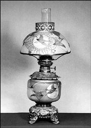 This 20-inch Royal Flemish table lamp with Guba ducks flying in a
night sky sold this spring at Early Auction in New Milford, Ohio,
for $25,100. It was complete with matching shade.