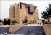 Workmen put finishing touches on the main entrance to the new
Cathedral of Our Lady of the Angels in Los Angeles. The cathedral,
which opens today, was designed to be a downtown landmark and a
crowning achievement in the career of Cardinal Roger Mahony, head
of America's largest Roman Catholic archdiocese. But clouding the
opening of the cathedral is an ongoing sexual abuse scandal and
financial problems within the church.