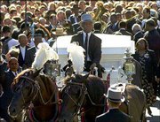 Vet Harris drives a horse-drawn hearse as he leads a funeral
procession for jazz musician Lionel Hampton on New York's Upper
West Side. Several hundred people joined Saturday in the New
Orleans-style street procession with music by Wynton Marsalis and
the Gully Low Jazz Band.