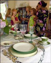 A formal dinner place setting is used to teach a course on table
etiquette at the Smoky Creek Summer School for Girls in Bogalusa,
La. For the past 18 years, Dixie Gallaspy has spent one week each
summer in this small timber town imparting the importance of
gracious living to girls from Louisiana, Mississippi, Alabama,
Texas and elsewhere.