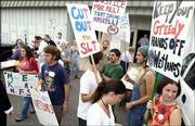 Kansas University students protest outside the public hearing on
proposed routes for the South Lawrence Trafficway.