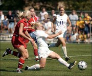 Kansas freshman Forward Caroline Smith lunges past a Nebraska
defender and sends a kick sailing into the net. Smith scored the
Jayhawks' only goal in the opening minutes of the second half in
their 1-1 tie with the Cornhuskers on Sunday afternoon at
SuperTarget Field.
