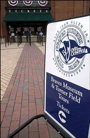 A sign points the way to ticket windows on an empty concourse
Monday at Atlanta's Turner Field. Just a handful of fans showed up
to buy thousands of unsold tickets for the playoff series against
San Francisco.