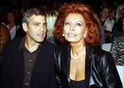 Actor George Clooney, left, and Italian actress Sophia Loren attend
the Giorgio Armani Spring-Summer 2003 fashion collection in Milan,
Italy.