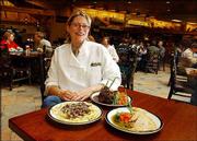 Janna Traver, executive chef and restaurant manager of the Yukon
Base Camp Grill in the new Cabela's store in Kansas City, Kan.,
shows off three of her specialties. They are, clockwise from left,
buffalo stroganoff; a mixed grill of bacon-wrapped quail, peppered
elk loin chops and roasted vegetables; and smoked duck quesadillas
with a jalapeelly dipping sauce.