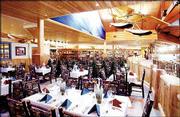 From 4 p.m. to 8 p.m. Monday through Saturday, six tables are set
aside for fine dining at Cabela's Yukon Base Camp Grill. The menu
features exotic meats such as elk, buffalo and quail.