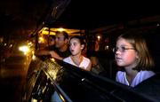 Quinn Albert, left, and his two daughters Lauren and Taylor, right,
gawk during a ghost tour with Hearse Tours in Savannah, Ga. With a
rich history dating to colonial times and plenty of age-old ghost
stories, Savannah is about to be named the most haunted city in
America.