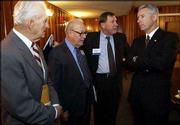 Former Kansas governors, from left, William Avery, John Anderson
Jr. and Mike Hayden, visit with Gov. Bill Graves before a
discussion at the Kansas Economic Policy Conference at Kansas
University. Thursday's conference at the Dole Institute of Politics
provided a dark outlook of Kansas' financial future.