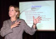 Paula Phillips, director of Douglas County Emergency Management,
discusses local response during a bioterrorism seminar at the
Lawrence Arts Center. Staff from community agencies learned about
bioterror threats and possible responses to a such an event during
Monday's seminar.