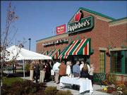 Applebee's neighborhood Grill & Bar is the first business to
open as part of a new retail shopping area being built adjacent to
the Hy-Vee Food and Drug Store at the corner of Sixth Street and
Monterey Way. Area residents participated in a ribbon-cutting
ceremony Monday outside the restaurant.