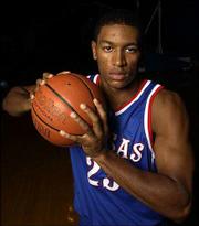 Kansas sophomore Wayne Simien will be expected to play a much
larger role this season after coming off the bench as a freshman.
The former Leavenworth High standout is projected as a starting
forward.