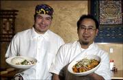 Alejandro Lule, left, and Subarna Bhattachan show off some dishes
at their restaurant Zen Zero, 811 Mass. The co-owners describe Zen
Zero as a Pan-Asian restaurant featuring foods from Nepal, Tibet,
Thailand, Vietnam and Japan with other cultural influences mixed
in.