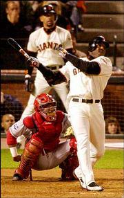 San Francisco's Barry Bonds watches his two-run homer off Anaheim's
Ramon Ortiz in Game 3 of the World Series. The Angels won, 10-4,
Tuesday in San Francisco, Calif.