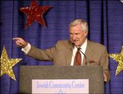 Former Kansas basketball player and legendary North Carolina coach
Dean Smith hassles former Missouri basketball coach Norm Stewart
while introducing Kansas coach Roy Williams. Smith, Stewart and
numerous other former KU coaches and players attended the 12th
Annual Sports Nite, a benefit for the Kansas City Jewish Community
Center, on Sunday at the Downtown Marriott.