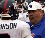 Kansas University coach Mark Mangino talks to Remuise Johnson after
a punt return during last Saturday's game at Missouri. Mangino will
face his former boss, Kansas State coach Bill Snyder, Saturday when
Kansas plays host to Kansas State.