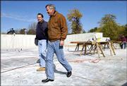 Jeff Hoffman, left, and Paul Pendry are in the process of
constructing a 13,000-square-foot office building for Commerce
Title at 1420 Wakarusa Drive. Pendry and Hoffman are co-partners on
the project, and Hoffman is the general contractor.