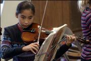 Akina Kashiwaya, a sixth-grader at Pinckney School, plans to vote
for Kathleen Sebelius for governor during the Kids Voting campaign
Tuesday because of party loyalty. "I&squot;m a Democrat," said Akina, who
plays violin in music class at school. "I think most of my family
is." The Kids Voting program enables children of all ages to go to
the polls Tuesday with a parent or guardian to "vote" on the same
issues and candidates as adults.
