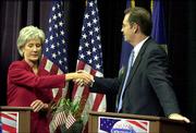 Kansas Democratic gubernatorial candidate Kathleen Sebelius, left,
shakes hands with Republican candidate Tim Shallenburger after
their Oct. 22 debate in Topeka. One of them will become
governor-elect Tuesday night.