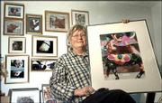 Lawrence photographer Shakura Jackson&squot;s photographic
interpretations of the Kansas City Cow Parade are part of a solo
exhibition called "Dreaming of Cows" at a Kansas City gallery. On
Tuesday, in her studio near Kansas University, Jackson displayed
one of her pieces from the cow parade.