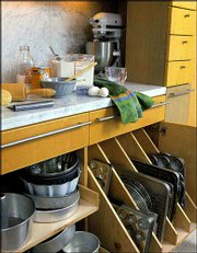 This baking center features a cool marble surface, just right for
rolling out dough, and clever storage for appliances, pans and
ingredients.