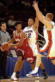 Stanford's Josh Childress looks for some help against Florida's
Justin Hamilton, left, and Matt Bonner in the first half during the
NIT at Madison Square Garden. The Cardinal beat the favored Gators,
67-65, on Wednesday.