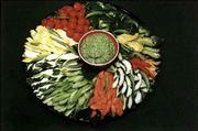 Taj Mahal Dip, which gets its green color from spinach, is shown
served with assorted cutup vegetables.