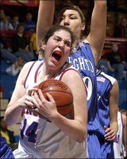 KU's Valerie Migicovsky brings down a rebound in front of
Creighton's Amy Hoffman. Creighton defeated Kansas on Saturday
afternoon at Allen Fieldhouse.