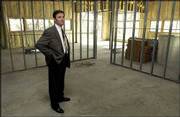 COMMERCIAL REAL ESTATE AGENT Kelvin Heck of Grubb & Ellis/The
Winbury Group checks out the progress of construction at the
Westgate Office Building, 4601 W. Sixth St. The building is among
about 410,000 square feet of unoccupied office space in Lawrence.
