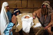 The Jackman family re-creates the manger scene, plus one, at
Vinland United Methodist Church. The Jackmans are, from left,
Leslie, who plays Mary; Tanner, 4, a "stage extra"; Chase, 4 weeks
old, as baby Jesus; and Clark, as Joseph. The church has presented
the living nativity since 1976. On Monday, the Jackmans kept the
tradition alive at the Vinland Fairgrounds, southeast of Lawrence.