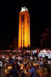 Nearly 3,000 people, including Kansas University students, wanting
to commemorate the anniversary of Sept. 11 gathered at the
Campanile Wednesday night to pay their respects to those who died
last year in the terrorist attacks.