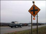 New flashing lights along U.S. Highway 59 near the Wells Overlook
intersection caution drivers that the intersection is ahead. The
lights are intended as a short-term solution for the dangerous
intersection; transportation officials say a new freeway still will
be needed to make the road safe.