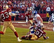 San Francisco defender Chike Okeafor (91) interferes with New York
Giant receiver Rich Seubert, second from right, in the final
minutes of Sunday's NFC Wild Card playoff game in San Francisco.
Also seen are 49ers Tony Parrish (33) and Ronnie Heard (38).