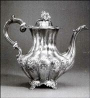 THIS ENGLISH VICTORIAN coffeepot was made in London. It is 9 1/4
inches high. The pot sold at Skinner's Auction Gallery in Boston a
few years ago for more than $700.