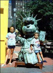 Kansas University fans Haley Holdredge, 11, and Adam Noreen, 4,
hang out with Lucy from Peanuts, posing as the Statue of Liberty in
St. Paul, Minn. Haley is the daughter of Jeff Holdredge and Karen
Noreen. Adam is the son of Frank and Karen Noreen. All are of
Minneapolis, Minn. Mary Rogers, Lawrence, submitted the picture.