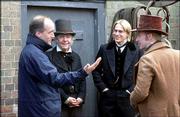 Filmmaker Douglas McGrath, left, discusses a scene with actors Tom
Courtenay, Charlie Hunnam and Kevin McKidd on the set of "Nicholas
Nickleby."