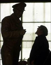 Sculptor Jim Brothers, right, looks over his statue of Gen. Dwight
D. Eisenhower at the Heartland Art Bronze Foundry near Lawrence.
The statue will replace one of former Kansas Gov. George Washington
Glick in the National Statuary Hall Collection at the U.S. Capitol
in Washington.