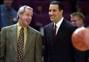 Kansas University coach Roy Williams, left, and UCLA's Steve Lavin
chat before their Coaches Vs. Cancer Classic game to open the
2000-2001 season. Lavin is expected to be fired at the end of this
season, and there is speculation the Bruins might make a run at
Williams to fill the vacancy.