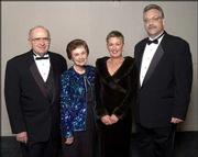 From left are Lawrence City Commissioner Jim Henry and his wife,
Kay Henry, retiring senior vice president of the Kansas University
Alumni Association, and Sandy Wellman and her husband, Mike
Wellman, director of Internet services at the Alumni Association.
The couples attended the Rock Chalk Ball Feb. 7 at the Overland
Park Convention Center and Sheraton Hotel.