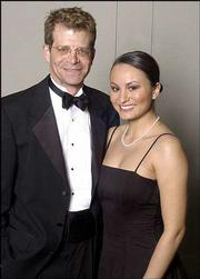 Bradley Kemp, assistant director of the Kansas University Museum of
Natural History, and Marilyn Nichols, instructor at Haskell Indian
Nations University, attend the Rock Chalk Ball. The theme for this
year's event was Jayhawk Fever. The dance featured the groovy tunes
of Disco Dick.