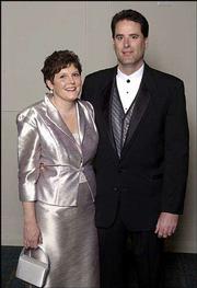 Susan Younger, art director for the Kansas University Alumni
Association, and her husband, Jerry Younger, a metro engineer for
the Kansas Department of Transportation, are pictured during the
Rock Chalk Ball. The Youngers live in Lawrence.