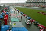 NASCAR Winston cup cars are lined up on pit road as it rains during
the Daytona 500. Sunday's race was cut short by inclement weather,
with Michael Waltrip winning after just 109 of 200 laps were
completed at the Daytona International Speedway in Daytona Beach,
Fla.
