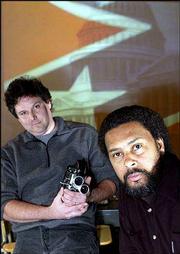 Lawrence-based director Kevin Willmott, right, and cinematographer
Matt Jacobson, both assistant professors in theatre and film at KU,
have completed "C.S.A. -- The Confederate States of America." The
movie is a mock documentary of what might have happened to America
if the South had won the Civil War.