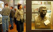 Visitors look at the displays at a Moscow exhibition to mark the
50th anniversary of Soviet dictator Josef Stalin's death. While
Stalin left a legacy of brutal repression, many Russians still
revere his leadership skills.