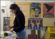 Lawrence artist Dawn Stender works on a papier-mâche skull in an
east Lawrence art space decorated with anti-war paintings. She and
other community artists are creating art to voice their opposition
to war. Stender was part of a group working to create anti-war
artwork Tuesday at David Loewenstein's studio, 411 E. Ninth St.
Below are examples of handbills being circulated by a Lawrence
artist who opposes war.