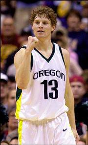 Oregon's Luke Ridnour celebrates after the Ducks locked an
automatic bid to the NCAA Tournament by winning the Pacific 10
tournament. Oregon beat Southern Cal, 74-66, Saturday in Los
Angeles.